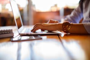 image of someone typing on a laptop