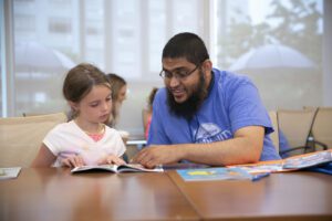 volunteer reading to student