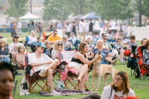 Group of people at free community outdoor event in downtown omaha at gene leahy mall